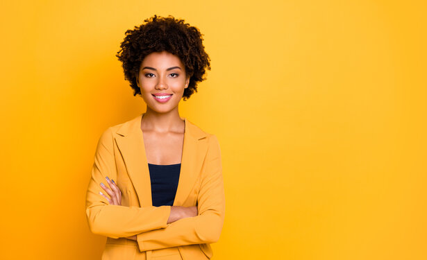 Portrait of her she nice well-dressed attractive lovely luxury pretty content cheerful cheery wavy-haired girl folded arms isolated over bright vivid shine vibrant yellow color background